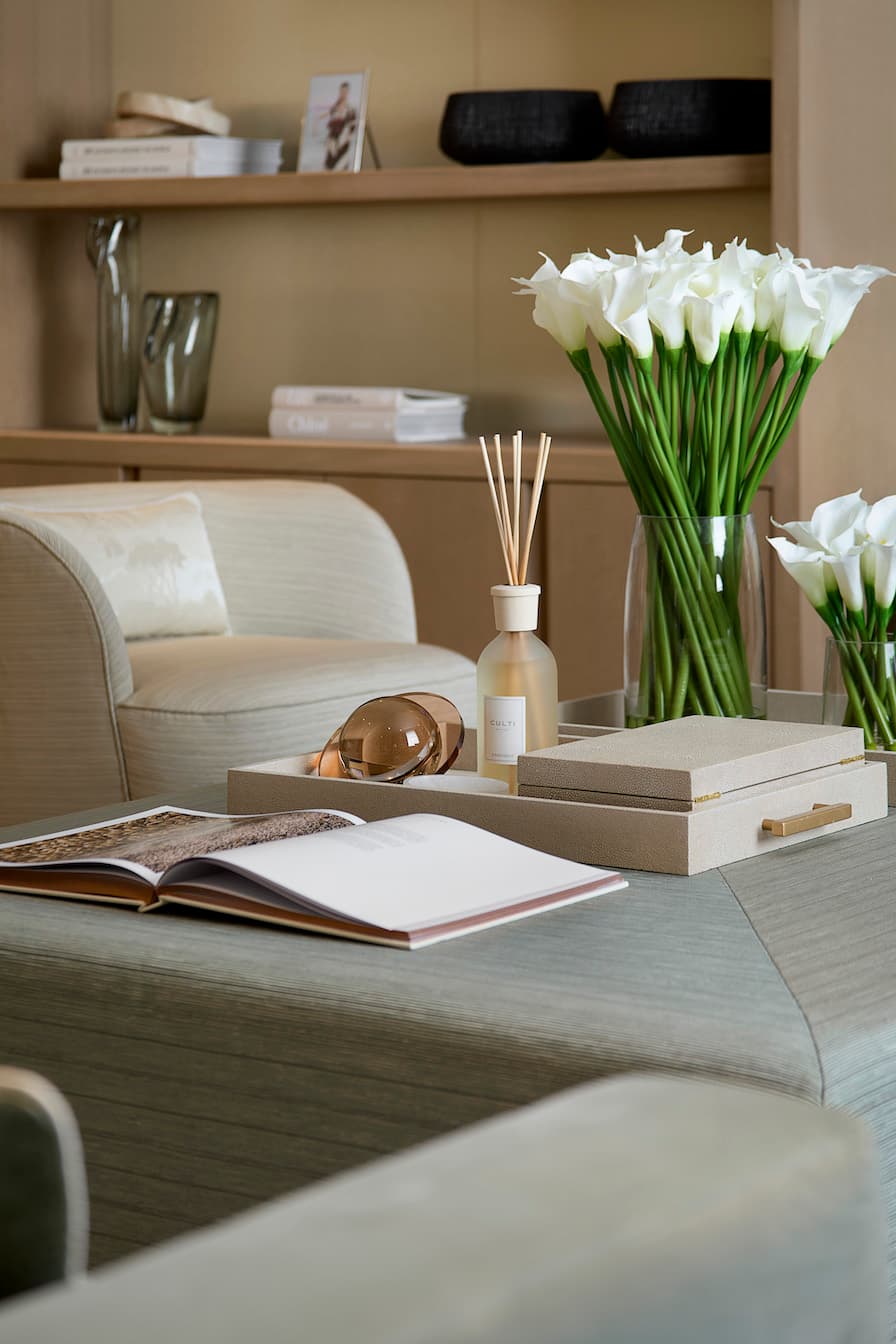 Close up shot in a living room with scented sticks and flowers