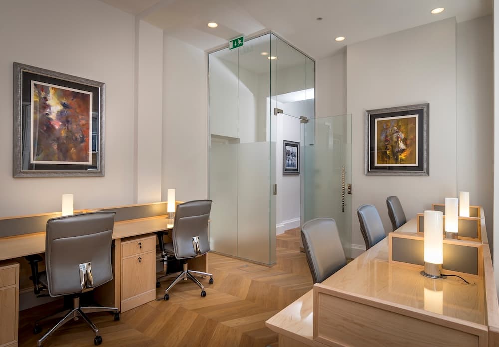 Executive meeting space with custom FF&E designed for discreet functionality